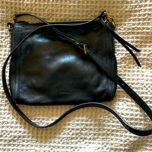 Black Fossil crossbody bag with brass hardware